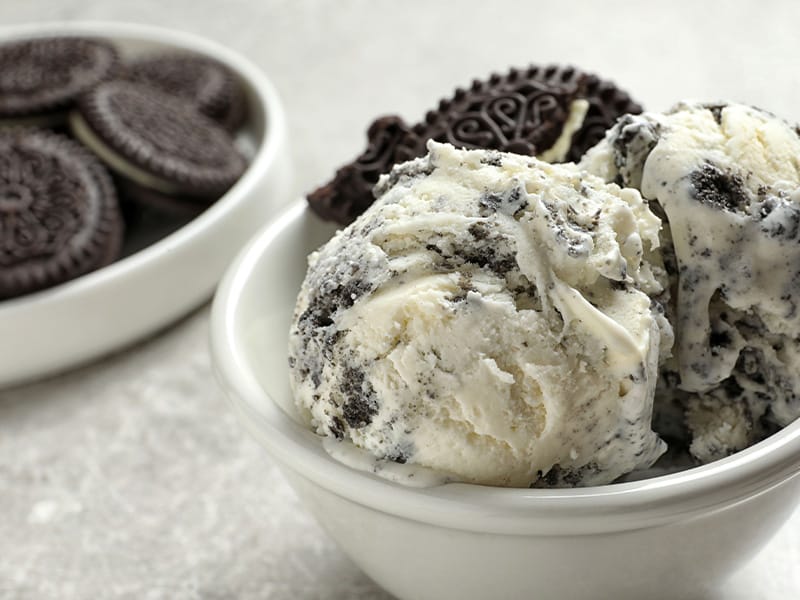 Chocolate sandwich cookies alongside cookies-and-cream ice cream